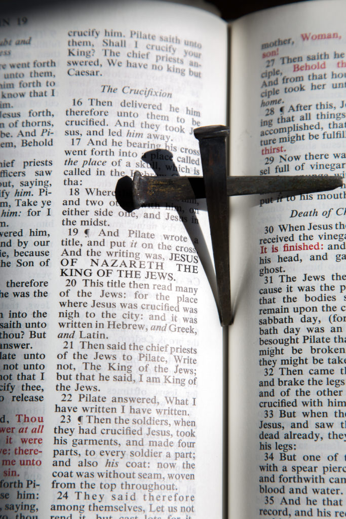Bible with nail cross