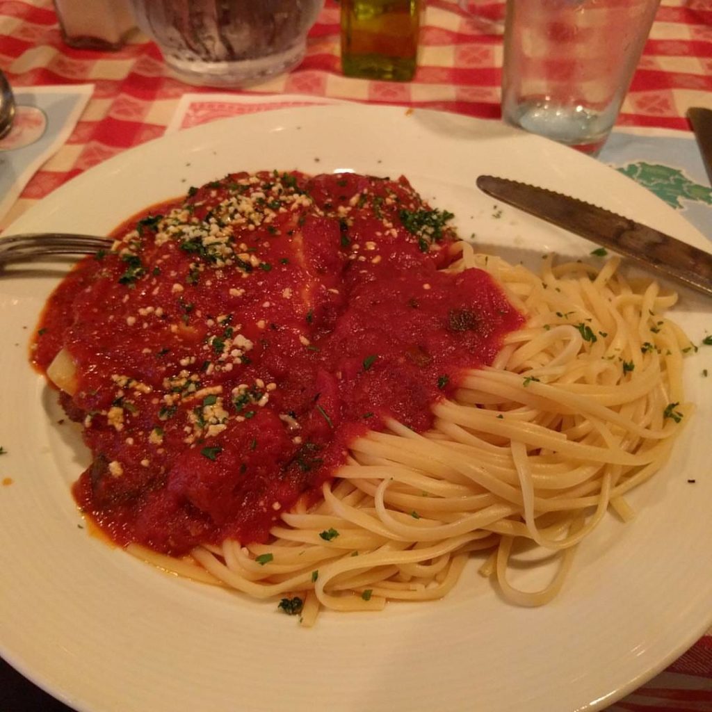 dinner plate with spaghetti and chicken parmesan
